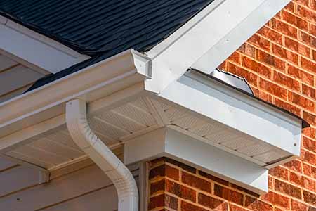 House with white seamless k style gutters